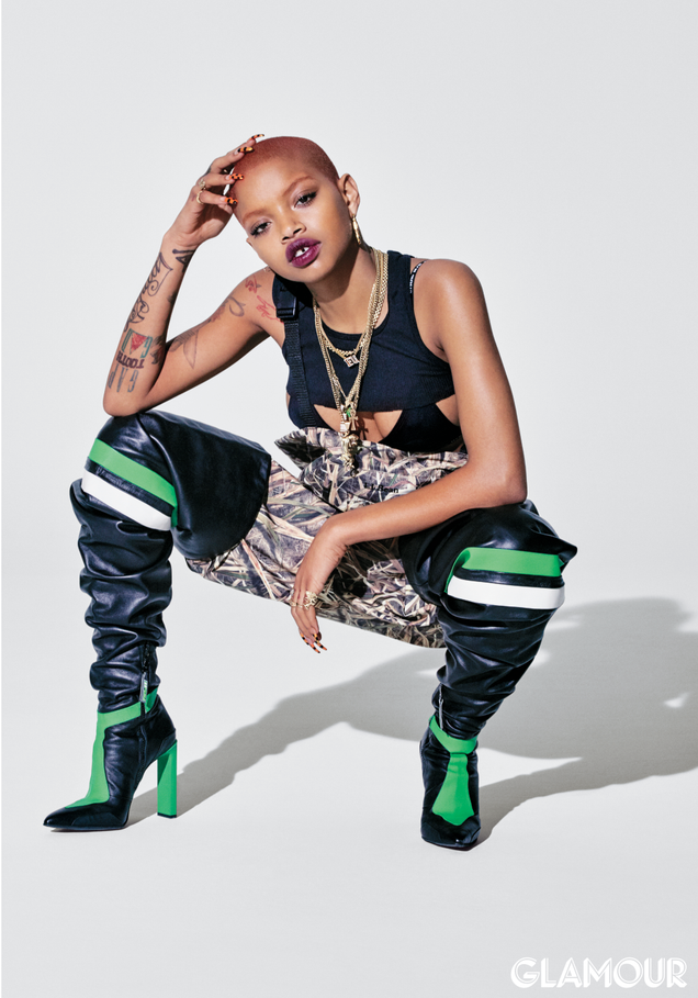 Hanes tank top. Heron Preston bikini top. L.L. Bean waders. Fenty Puma by Rihanna boots.